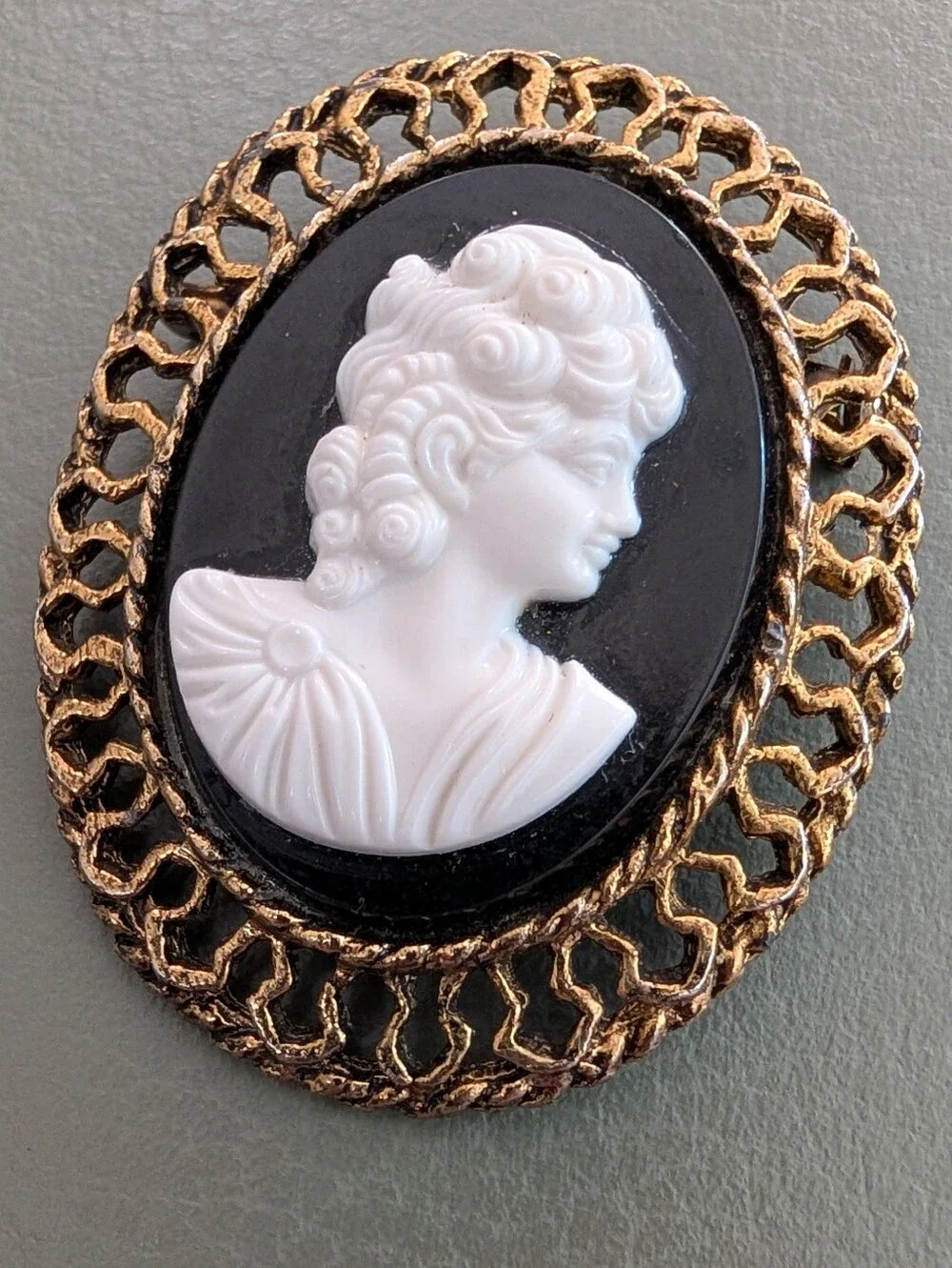 Classic Black and White Cameo Brooch with Gold Frame